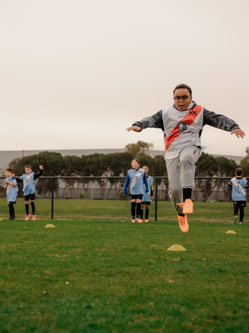 Coach Gavin striking a ball in his River Plate kit