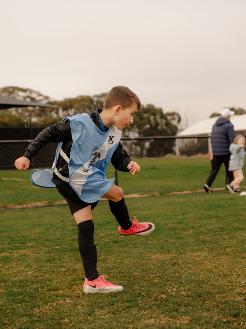 A player striking the ball in a GDF kit