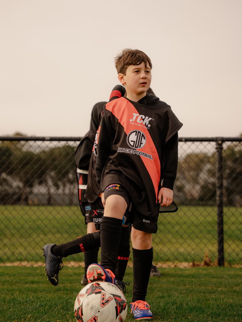A player dribbling the ball forward