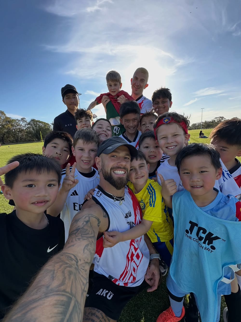 Coach Gavin de Niese with a group of GDF players